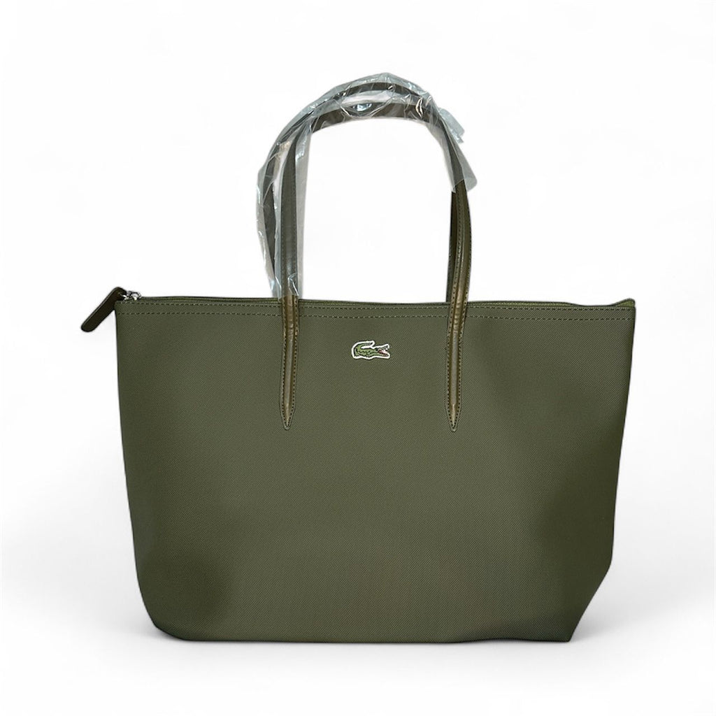 Green handbag with a brand logo on a white background