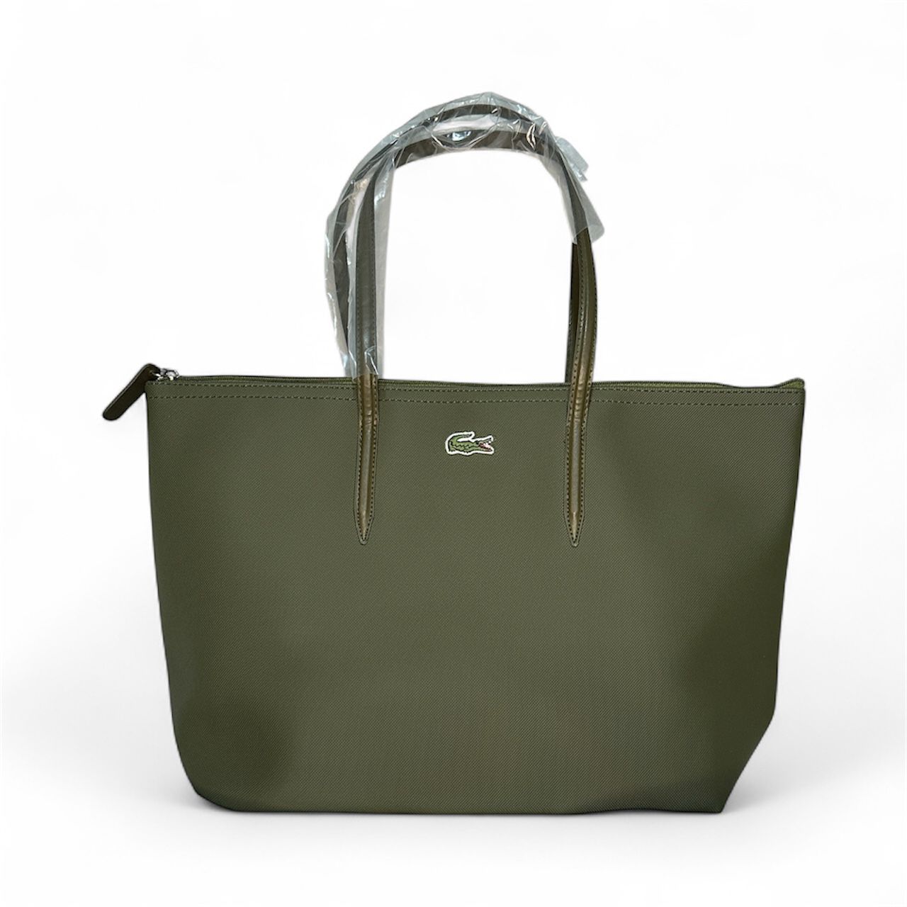 Green handbag with a brand logo on a white background